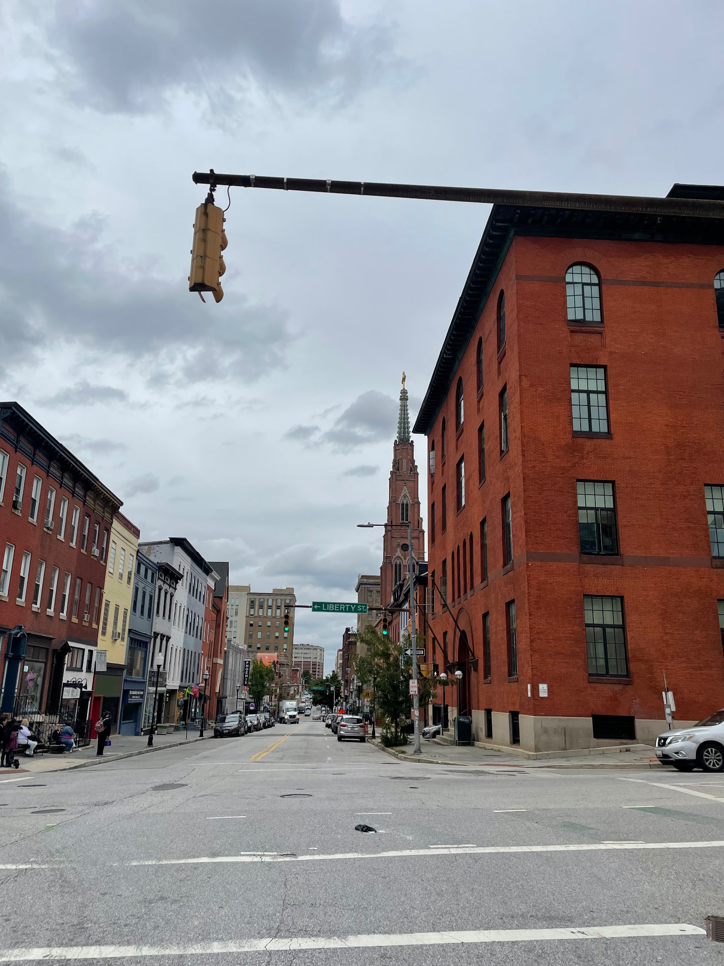 Baltimore rowhouses and a church spire on Liberty Street